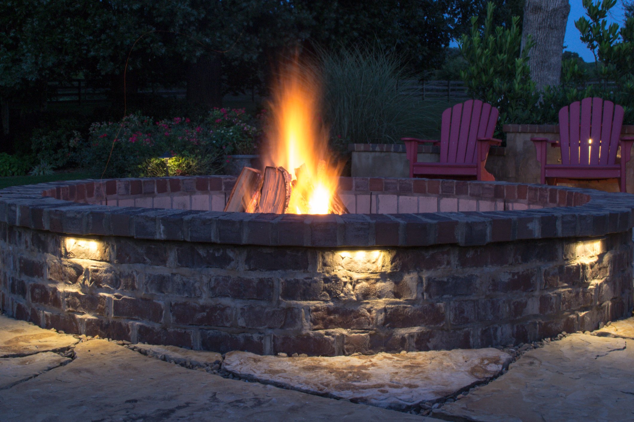 Brick paver fire pit with fire