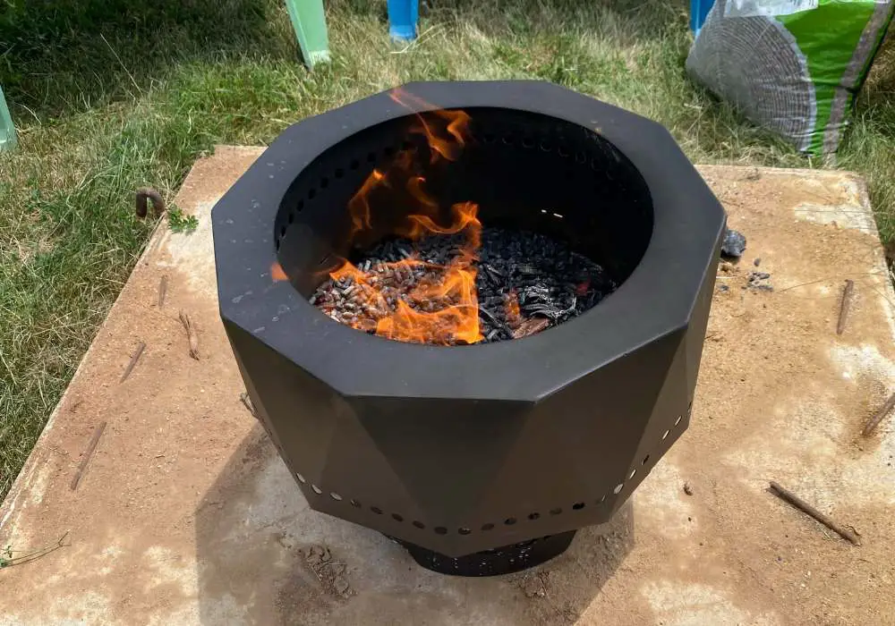 flames coming from a portable fire pit burning pellets