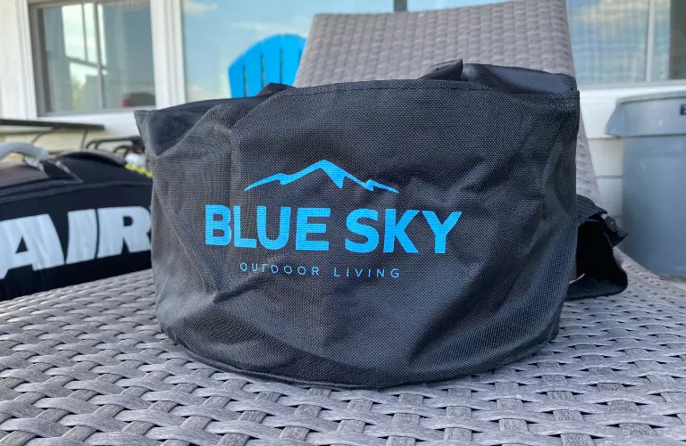 blue sky travel bag on a chair