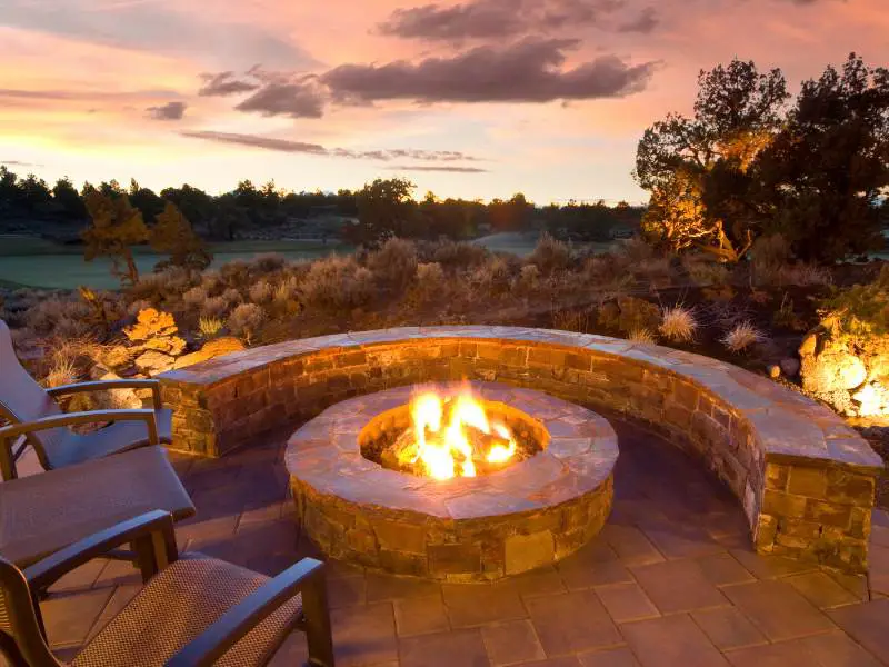 a beautiful stone fire pit overlooking the desert