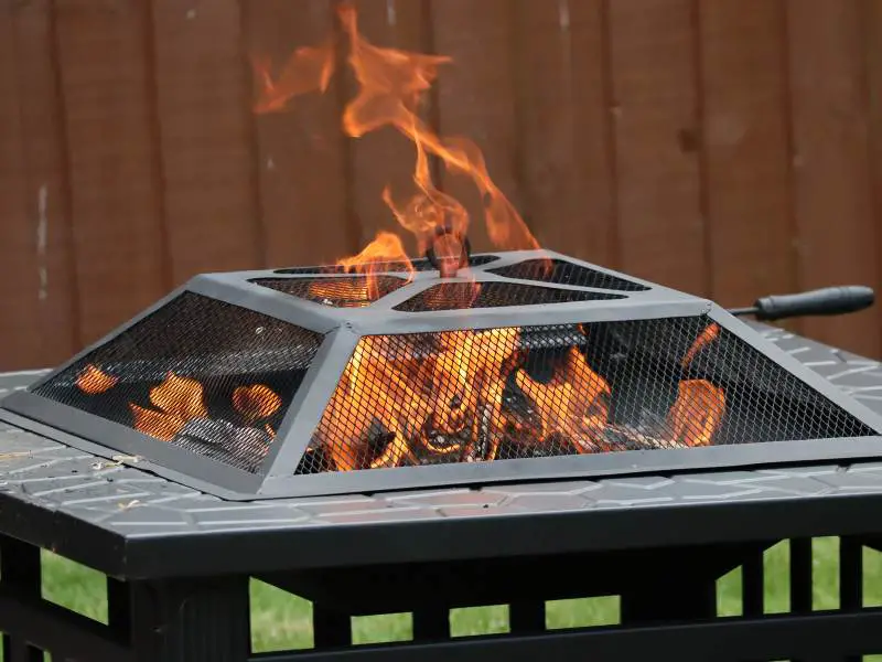 a metal fire pit burning
